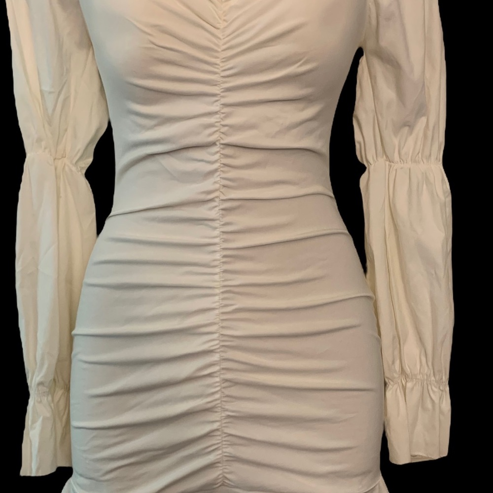 It’s a long sleeve dress stretching new with tag and it’s white